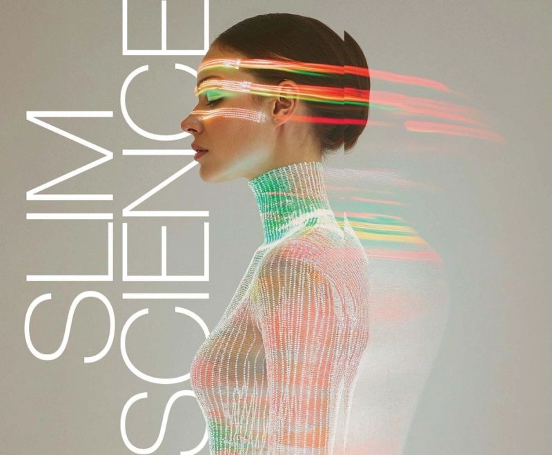 EDITORIAL STYLE PHOTO OF A WOMAN WITH A SUBTLE COLORFUL LIGHTS ACROSS HER ENTIRE BODY