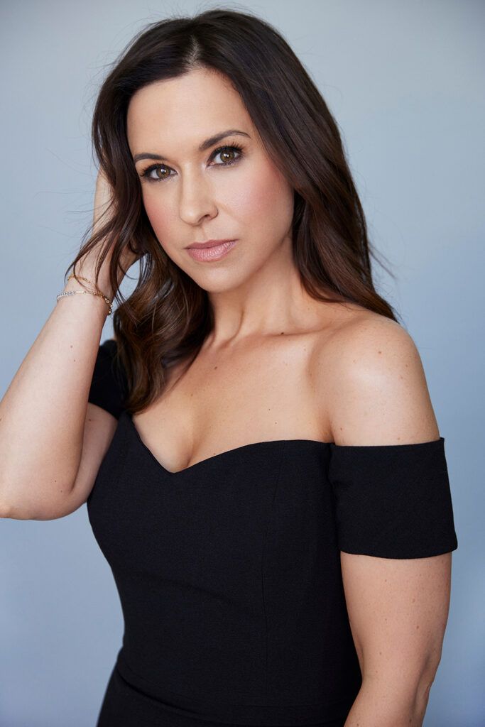 Lacey Chabert in black off-the-shoulder dress