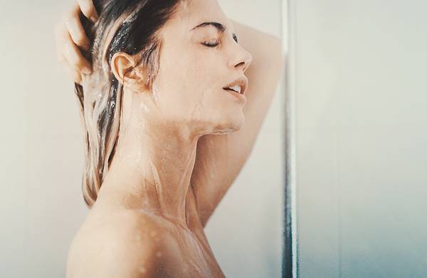 woman in shower washing hair