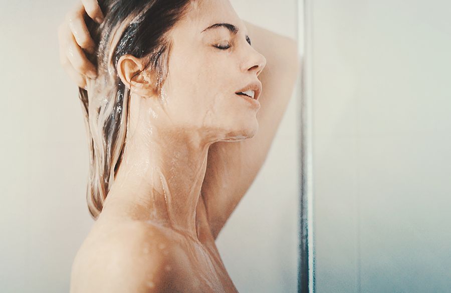 woman in shower washing hair