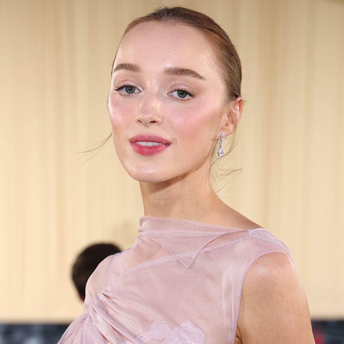 Phoebe Dynevor attends the 2024 Met Gala in pink dress