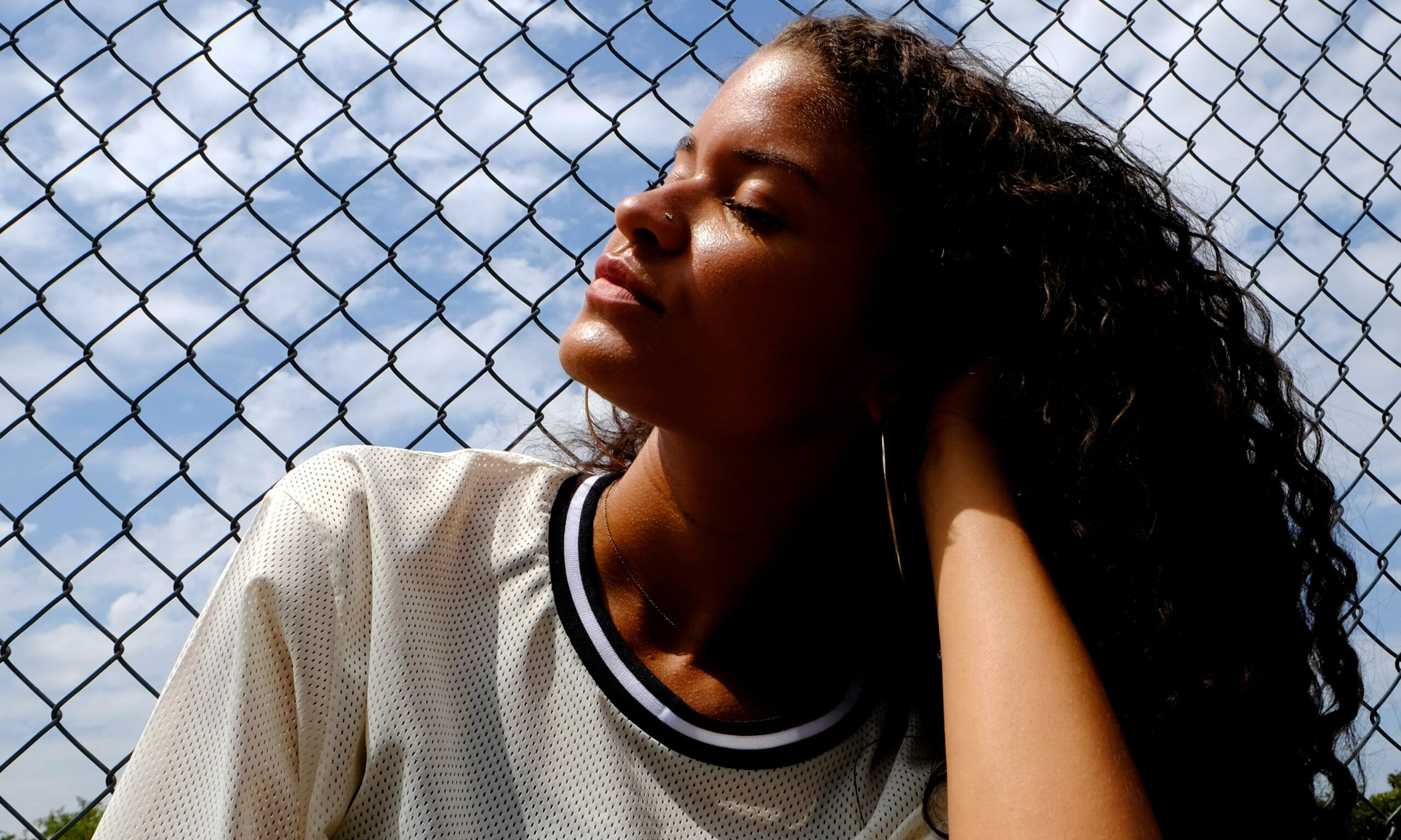 woman with curly hair outdoors