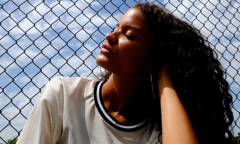 woman with curly hair outdoors