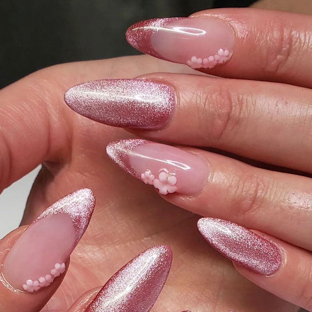Pink cat-eye manicure with a French accent nail