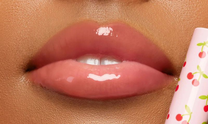 Tarte cherry lip gloss on lips