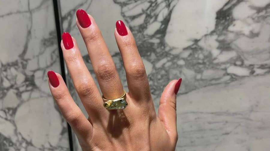 Natural nails with cherry-red polish