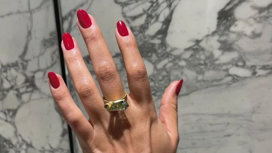 Natural nails with cherry-red polish