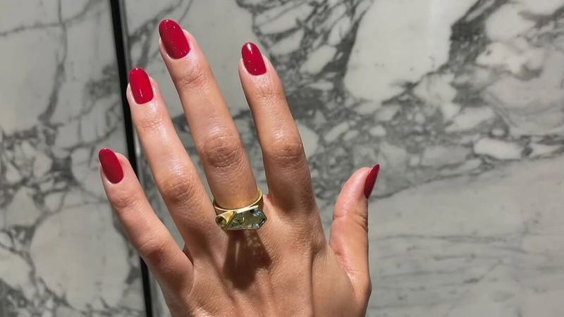 Natural nails with cherry-red polish