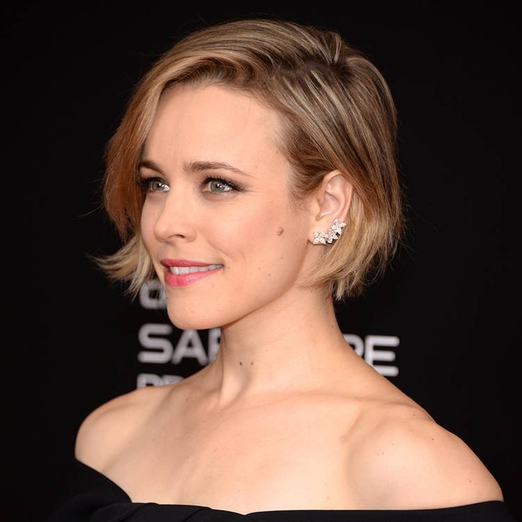 Rachel McAdams posing with short hair on the red carpet in black off-the-shoulder dress 