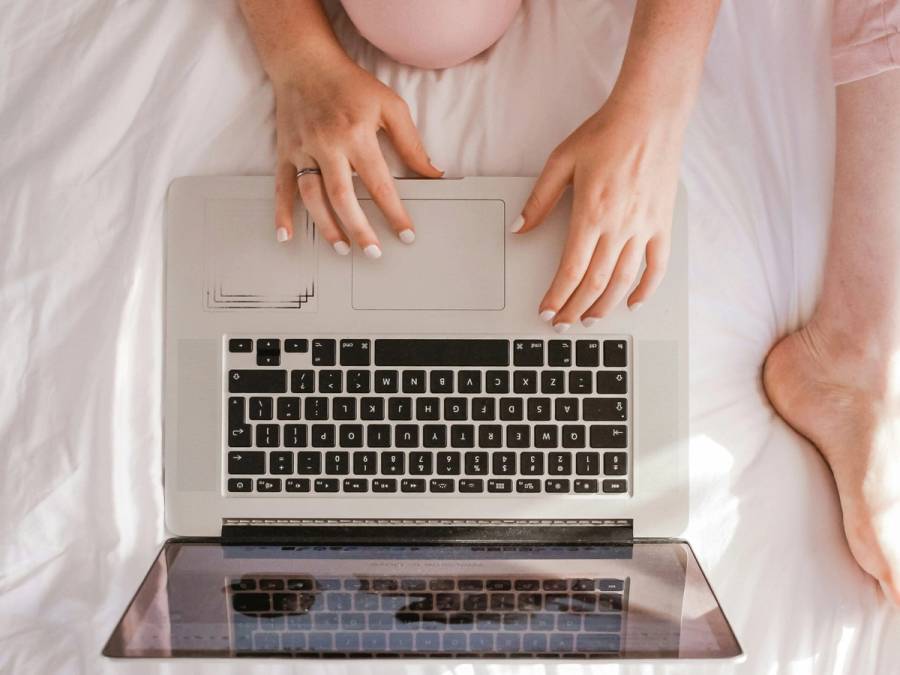 overheard view of woman on laptop
