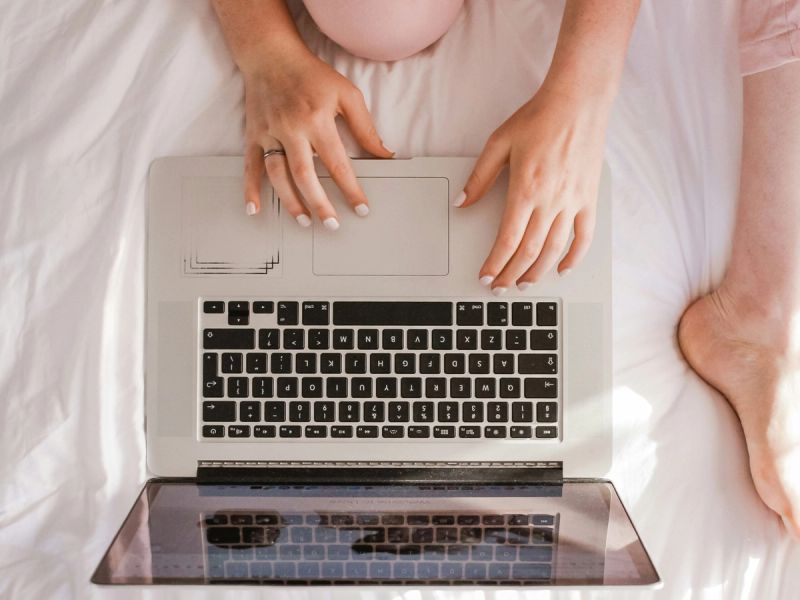 overheard view of woman on laptop