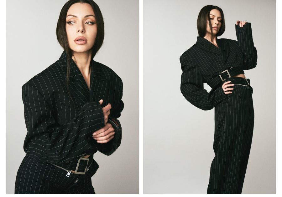 Side-by-side studio portraits of actress Neraida Bega wearing a black pinstripe suit, featuring a close-up beauty look and a full-body pose, highlighting her sleek hair and natural makeup