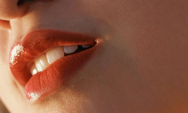 close up of woman's lower fave including lips and teeth