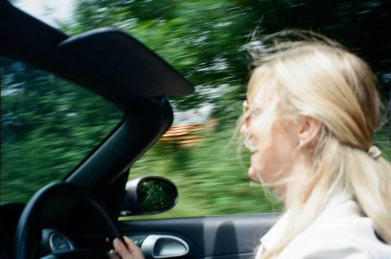 woman driving in sunshine