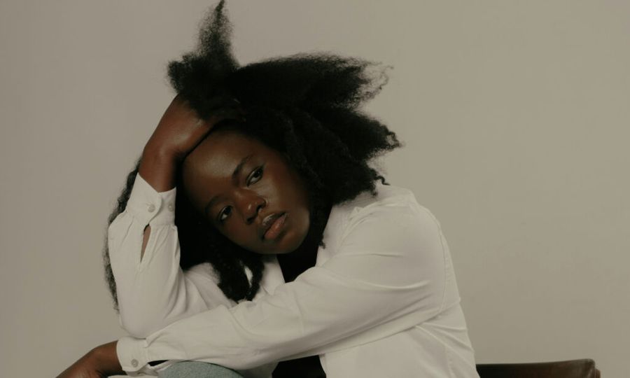 woman with hand in her hair