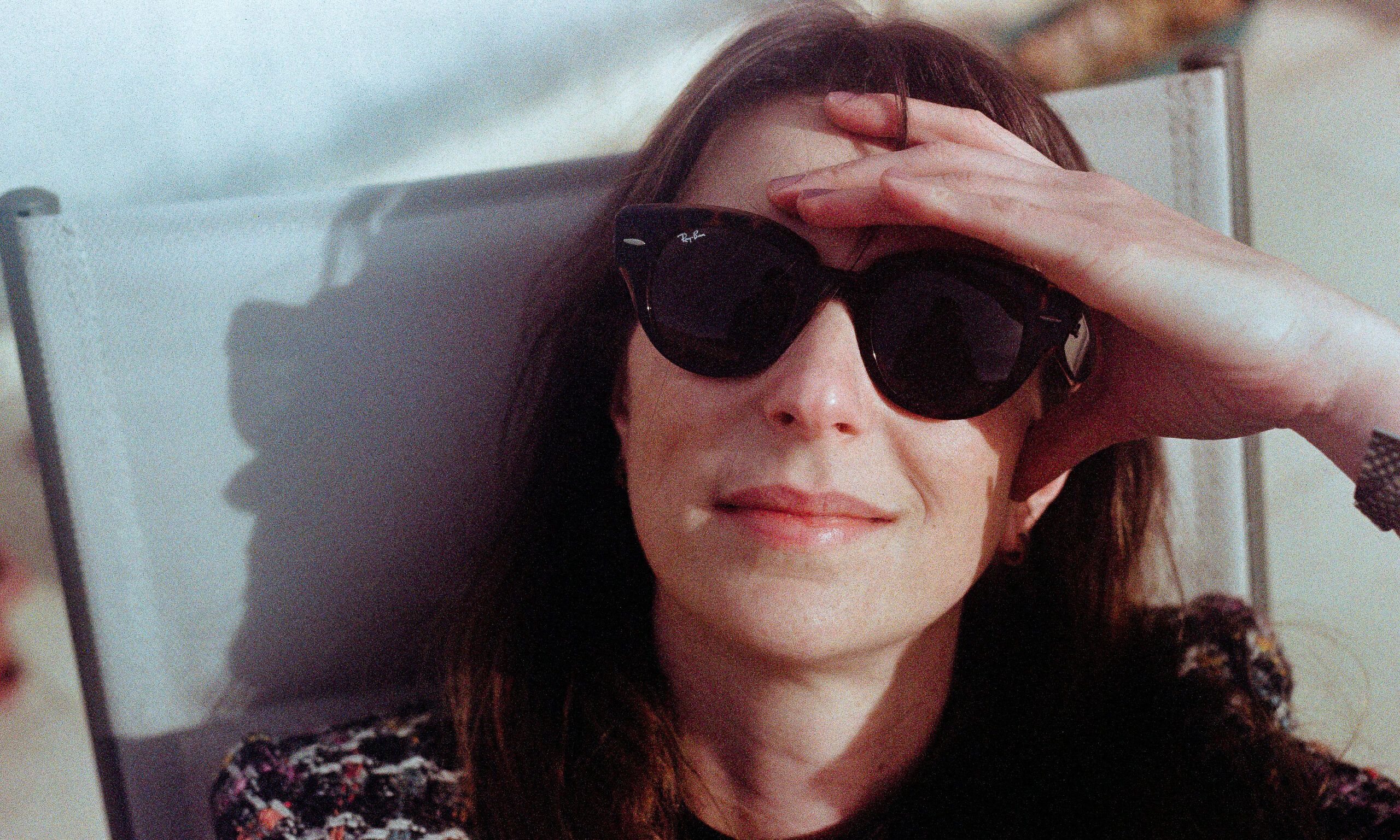 middle aged woman in sunglasses