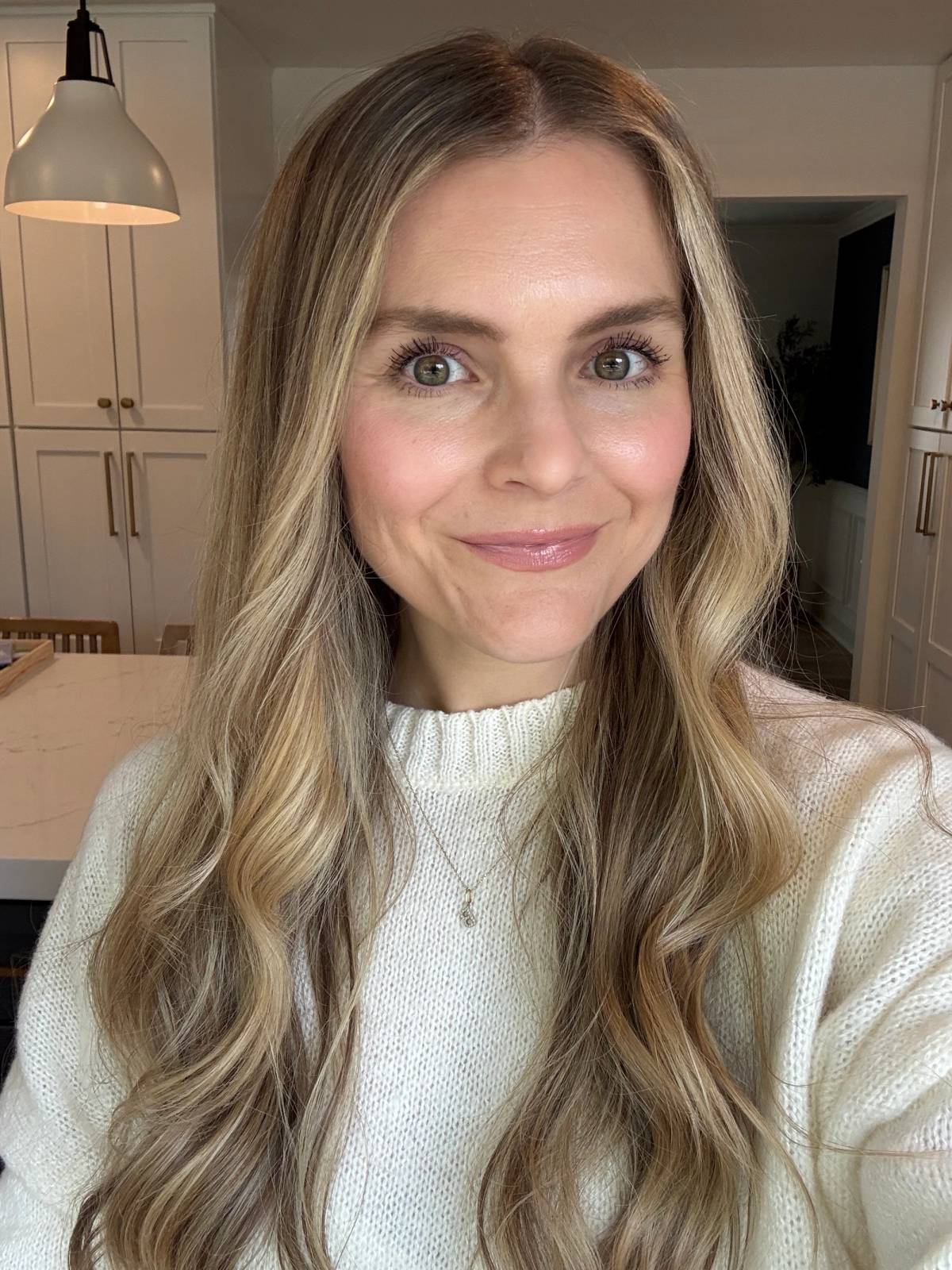 woman wearing no makeup makeup pink lipstick