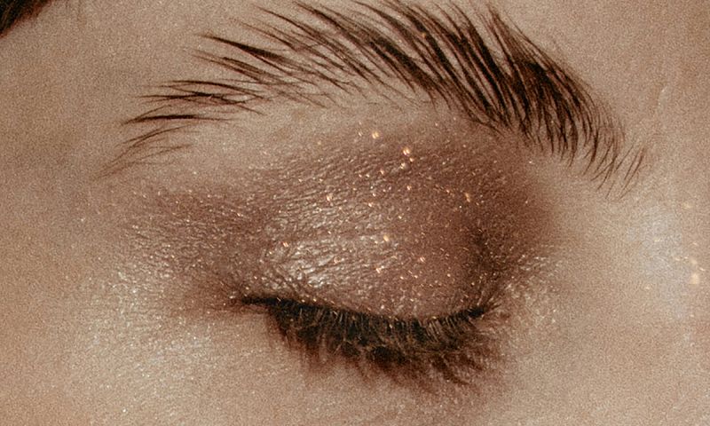 close up of glittery eyeshadow on eyelid