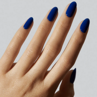 image of hand with navy blue manicure