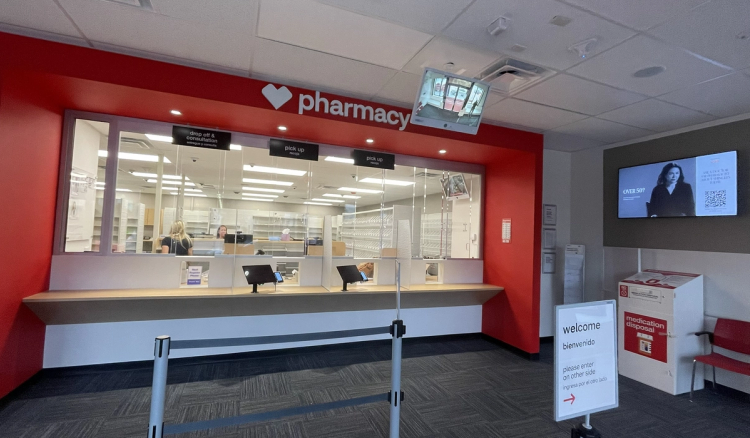 CVS pharmacy counter in Roxbury with drop-off and pick-up windows and a medication disposal bin