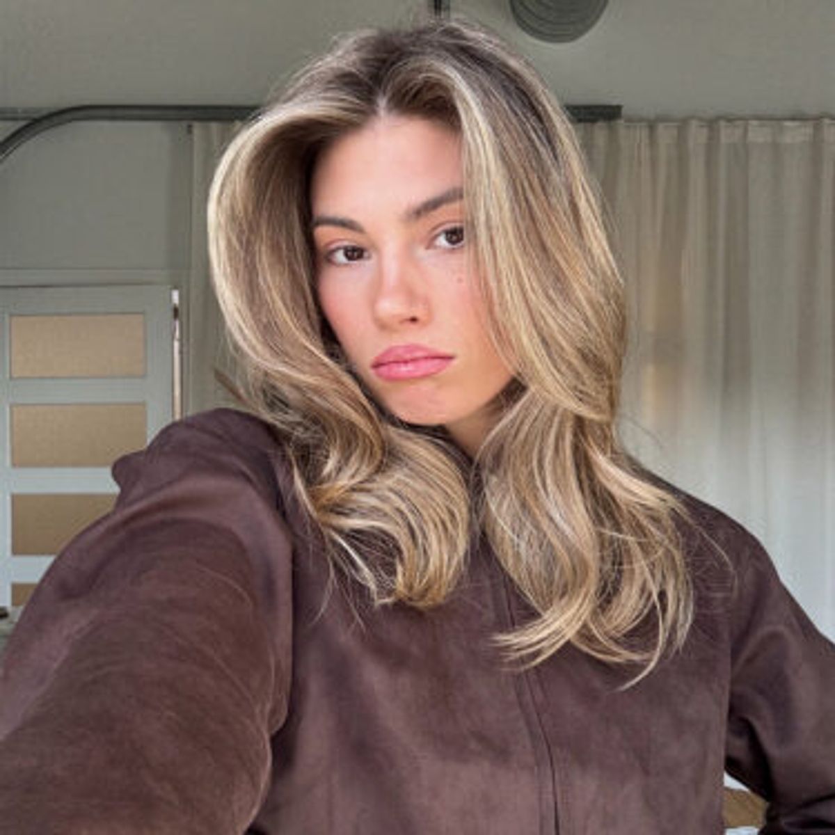 selfie of woman with a 90s haistyle