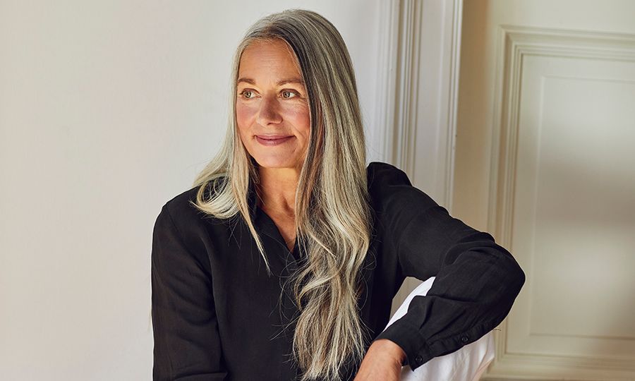 woman with gray hair wearing a black blouse