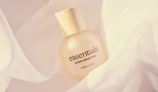 Bath & Body Works Essentials Vanilla Silk perfume bottle nestled in soft cream-colored fabric.
