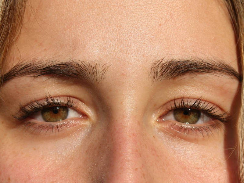 woman with brown eyes looking forward