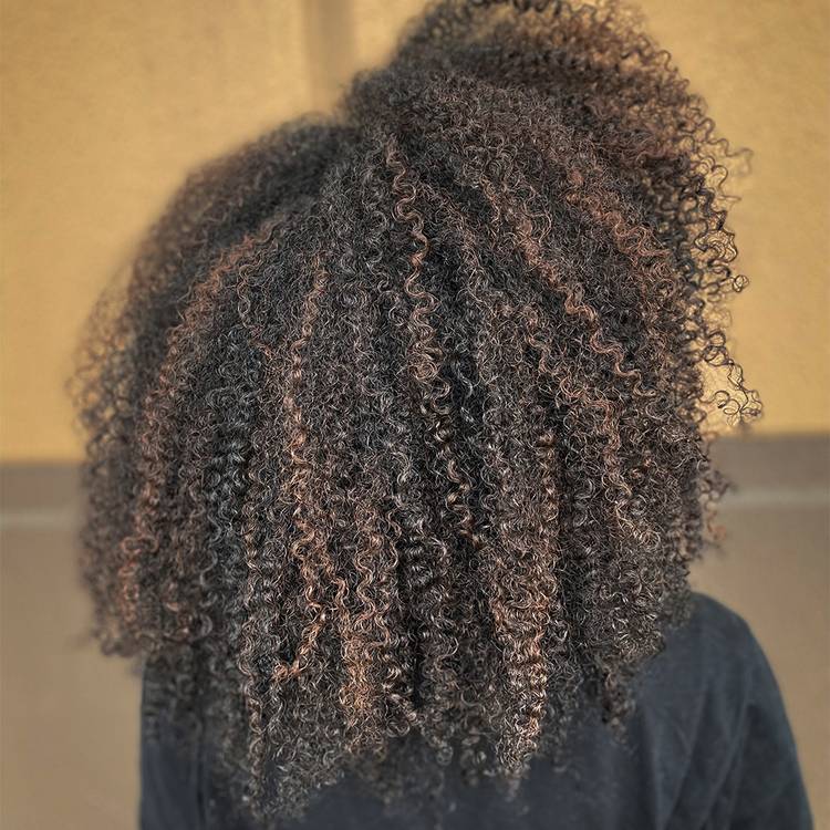 Multi-tonal brunette curl hair