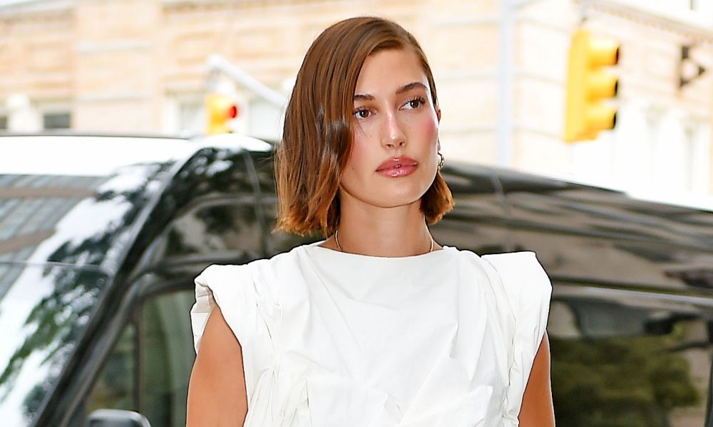 Hailey Bieber with a short auburn-brown bob