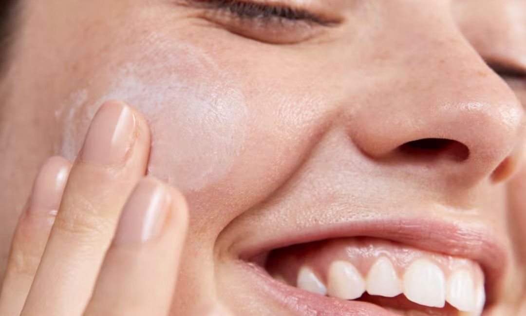 woman using Avène Tolerance cream
