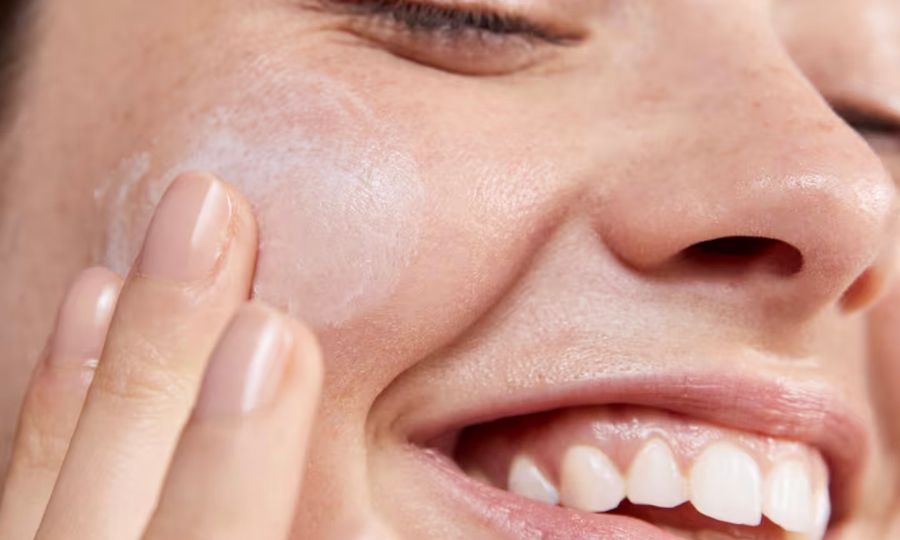 woman using Avène Tolerance cream