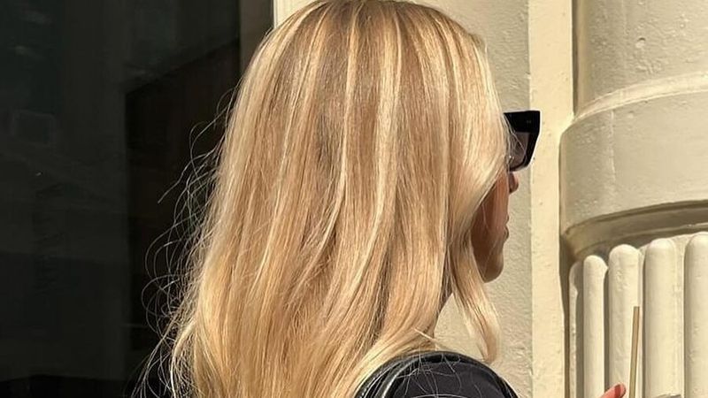 A women with butterscotch blonde hair color