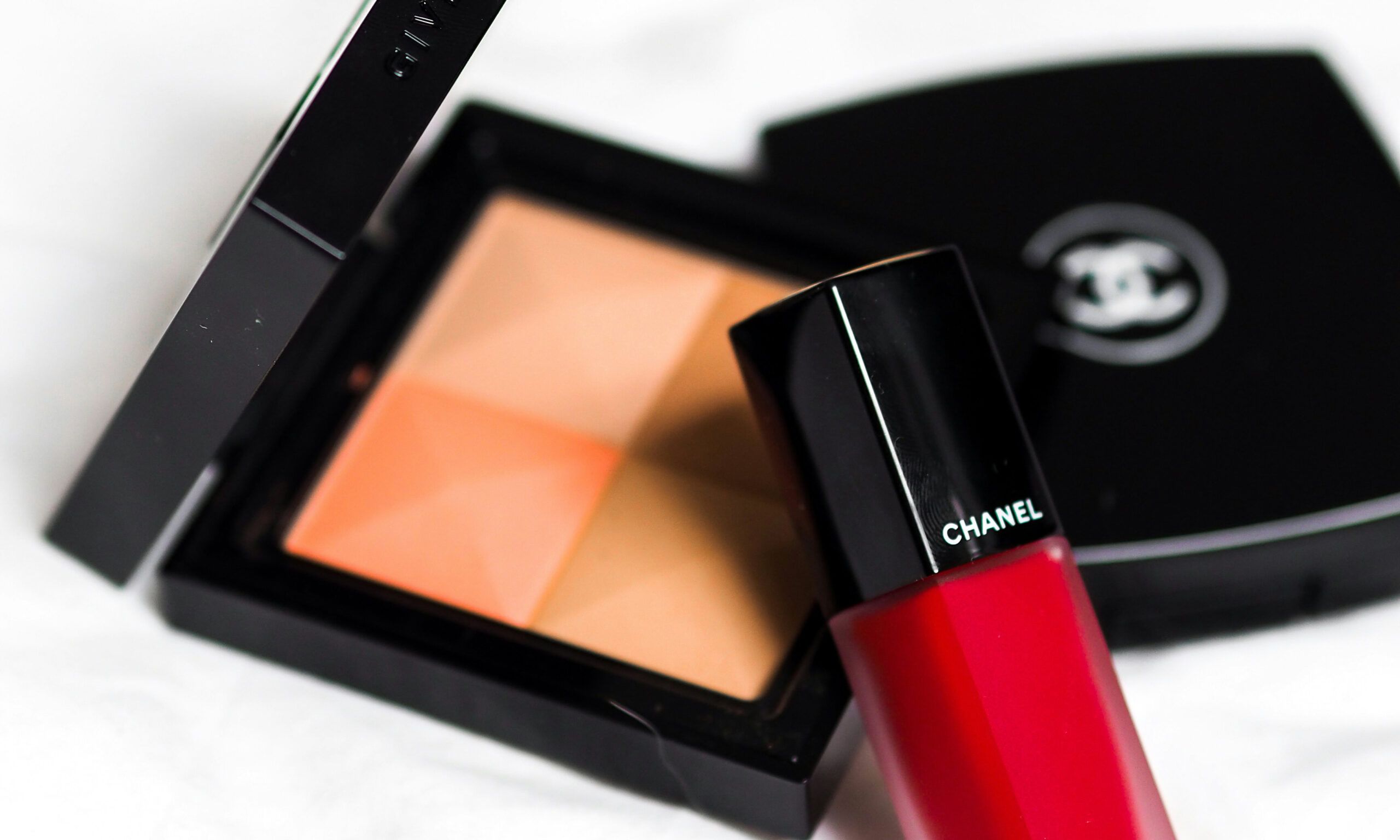 Chanel makeup palette and red lip product