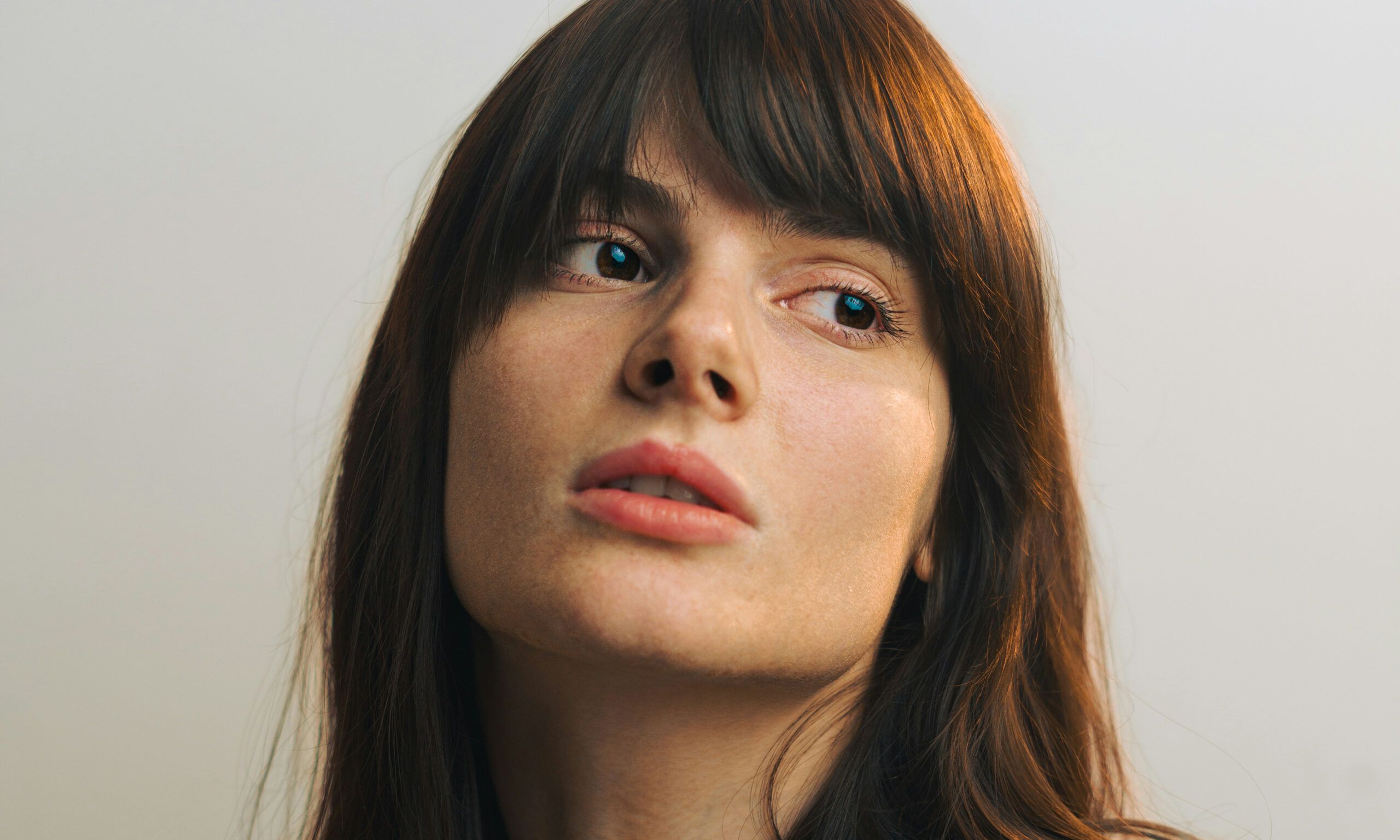 portrait of young woman with dark bangs