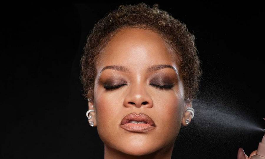 Rihanna with short natural hair in a Fenty Beauty campaign