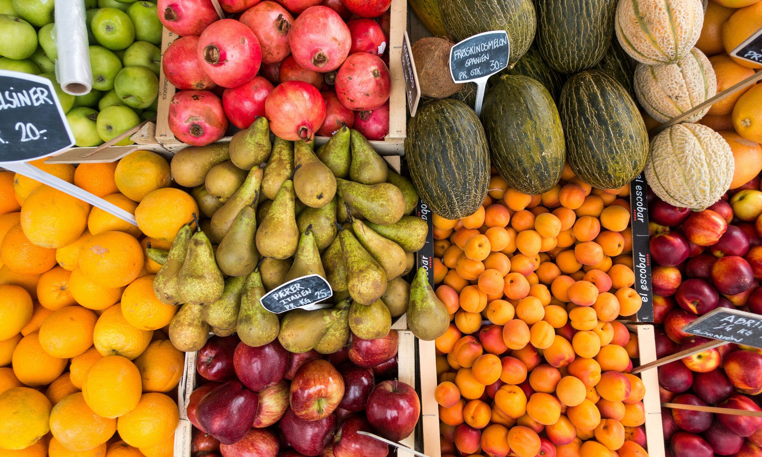 produce stands of fruits at outdoor market