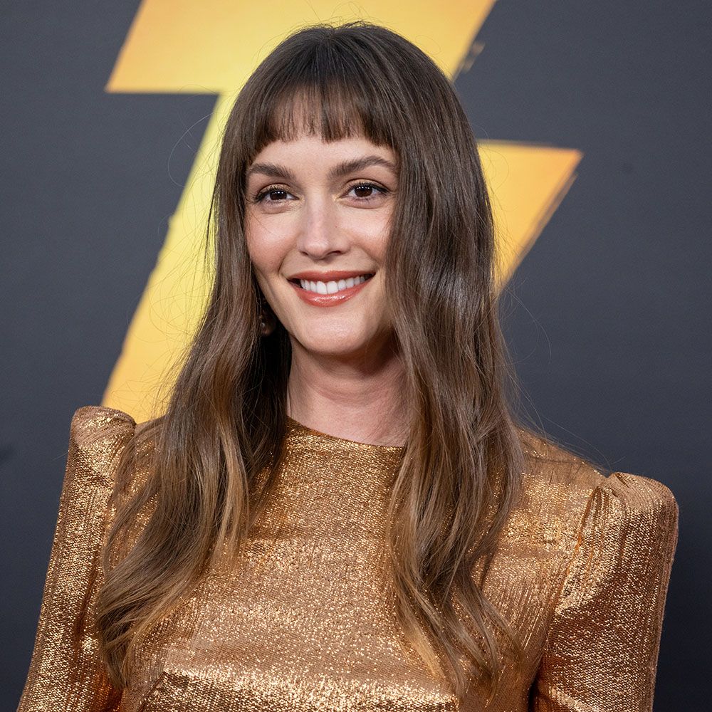 Leighton Meester with short bangs wearing a gold dress 