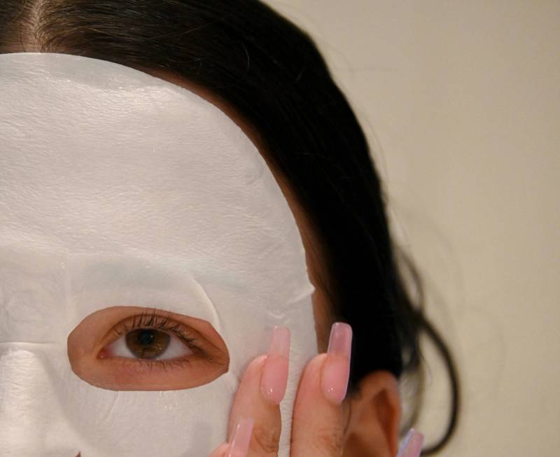 zoomed in of part of woman's face wearing a sheet mask