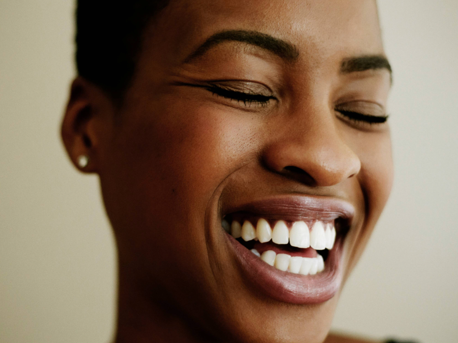 woman smiling and laughing