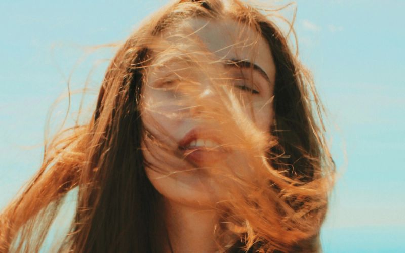 woman with red hair in the wind