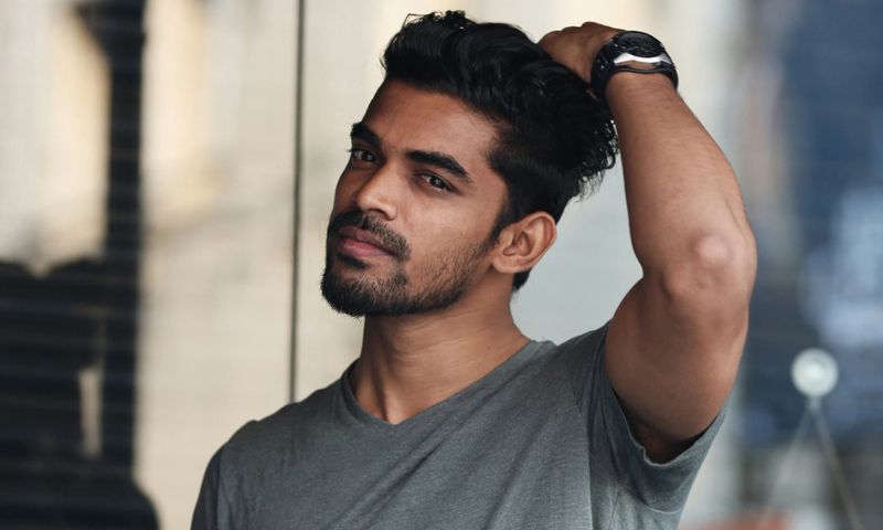 handsome man touching his hair