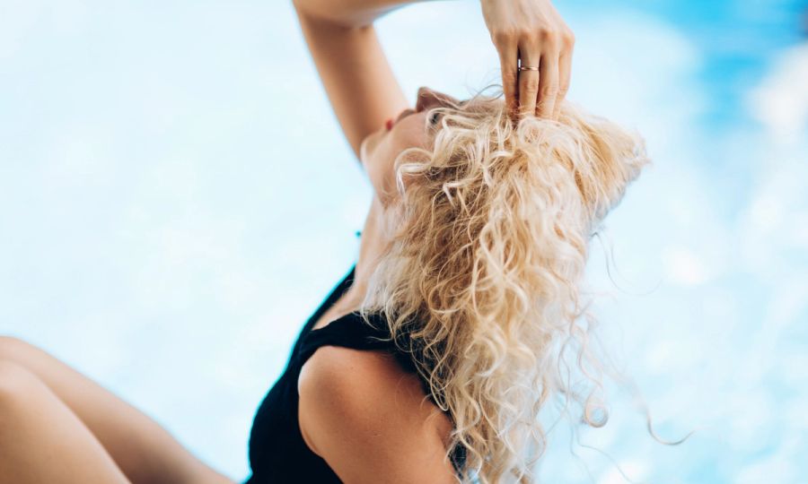 woman with blonde curly hair