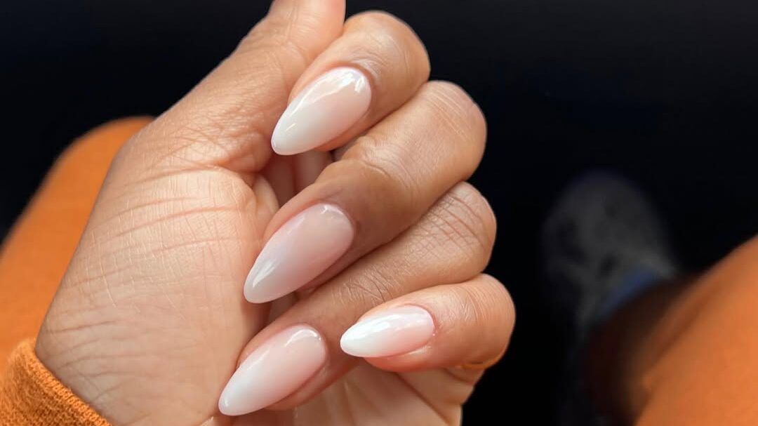 Almond nails with light pink and cream colors