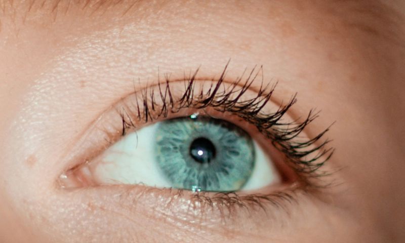 close up of woman with greenish blue eye