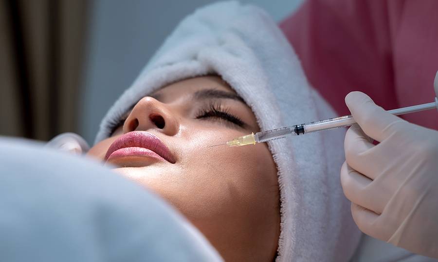 Beauty treatment with hyaluronic collagen injection,Young woman has a Botox injections,Cosmetology and skin care,Plastic surgery clinic.