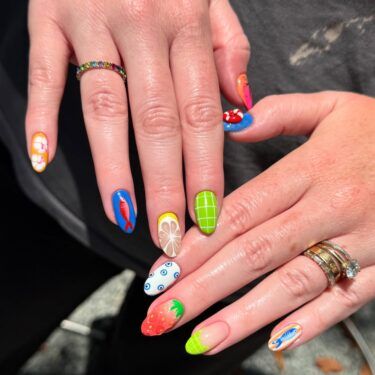 Oval shaped nails with mixed nail art designs