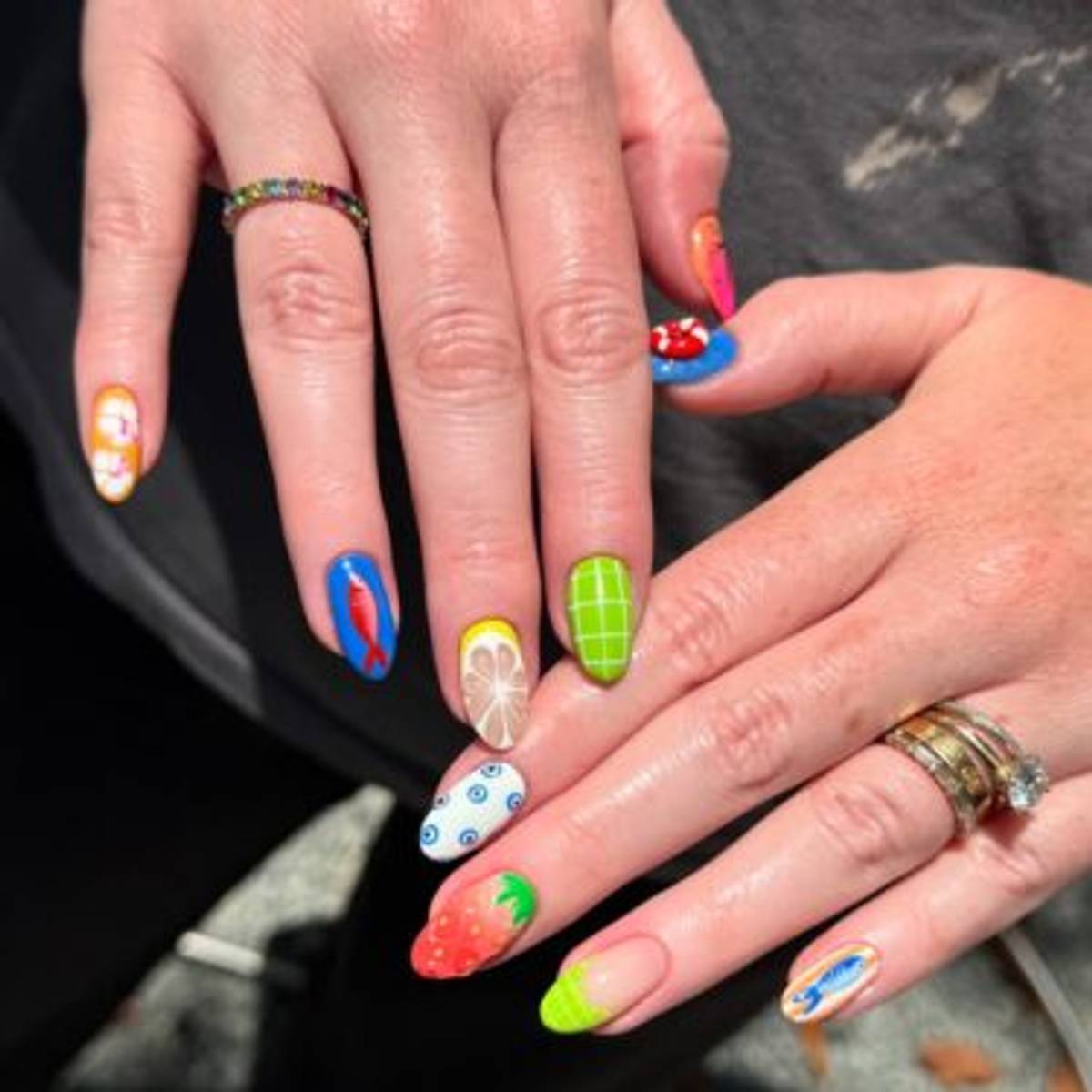 Oval shaped nails with mixed nail art designs
