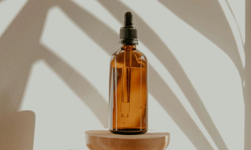 dropper bottle against a shadow backdrop