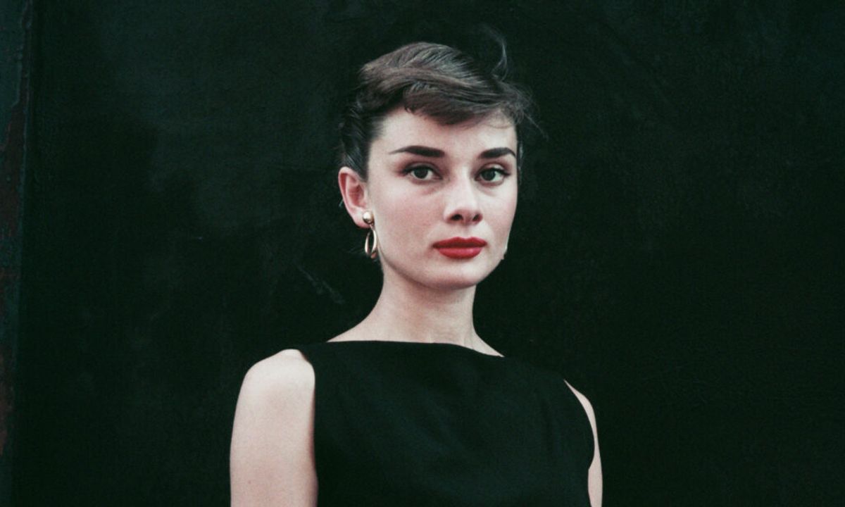 Belgian-born actress Audrey Hepburn (1929 - 1993) in a black sleeveless dress, circa 1955.